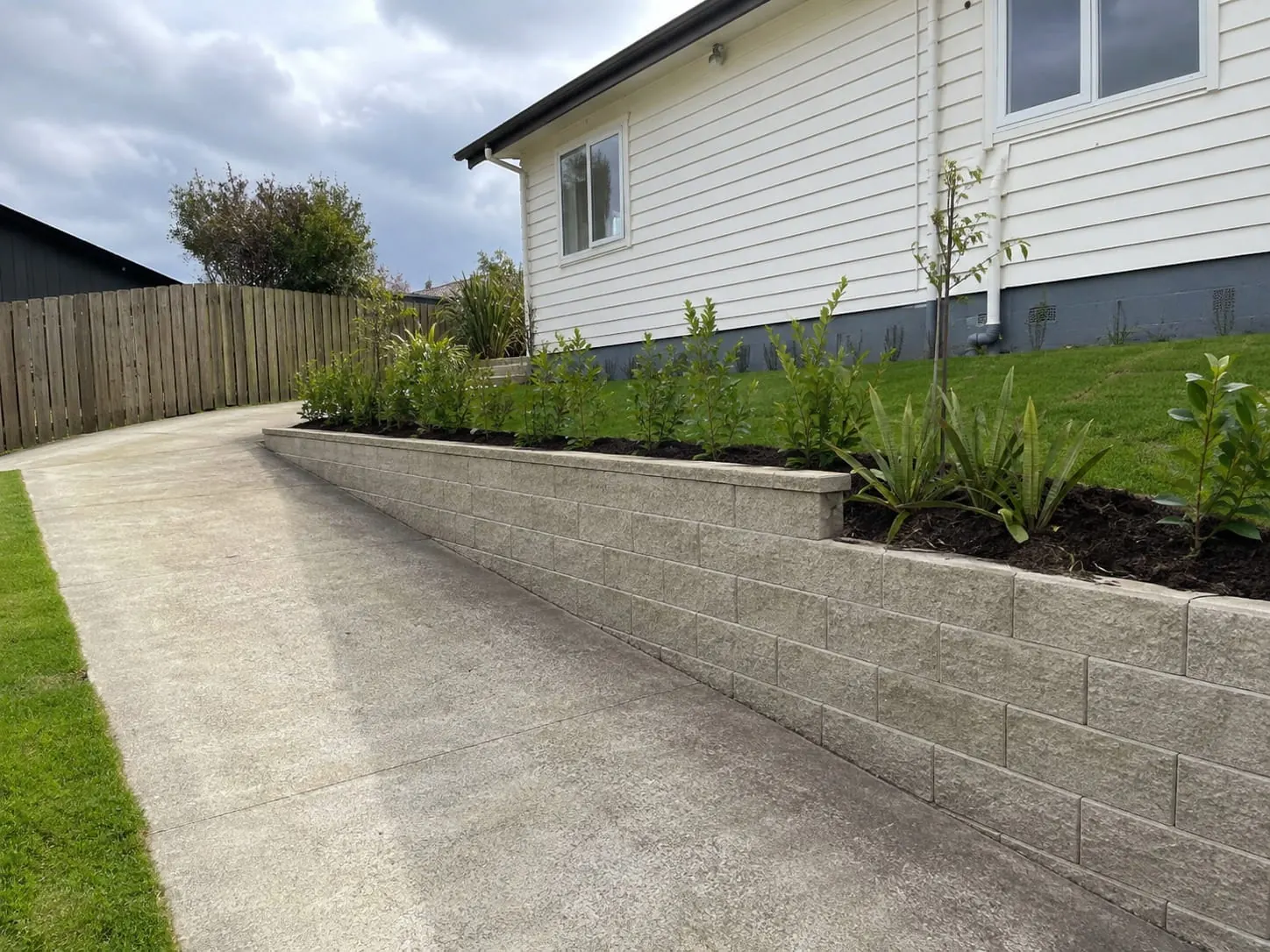 Concrete block retaining wall on a clay section in Massey, West Auckland