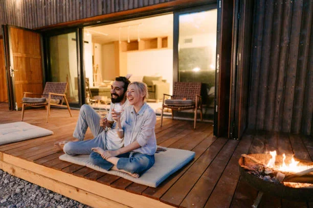 Auckland couple relaxing on a timber deck