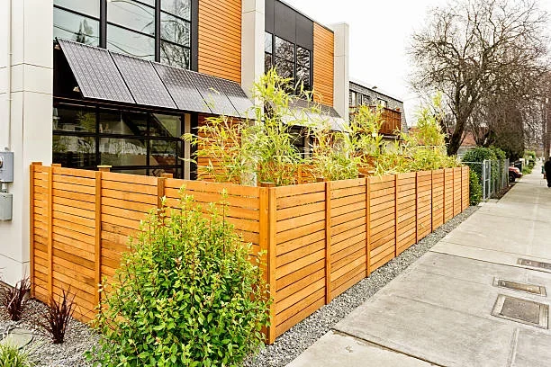Timber landscape construction beside an Auckland home