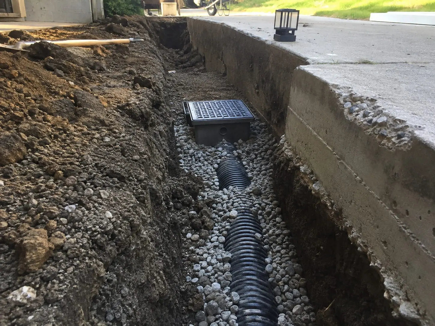 Drainage trench dug across an Auckland lawn